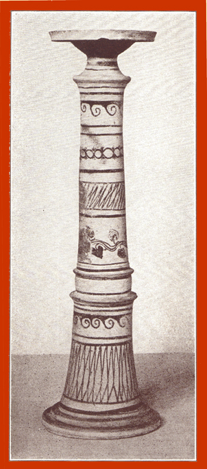 Black and white photograph of a taller decorated clay incense burner.