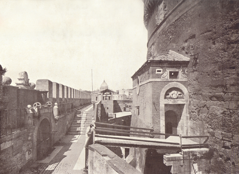 A black and white photograph of the entrance and ditch of the Castle of Sant’ Angelo.